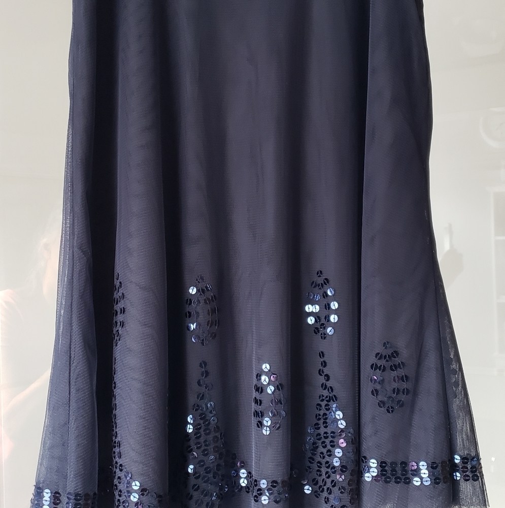 Adorable new with tags navy skirt with navy sequins at bottom size 1